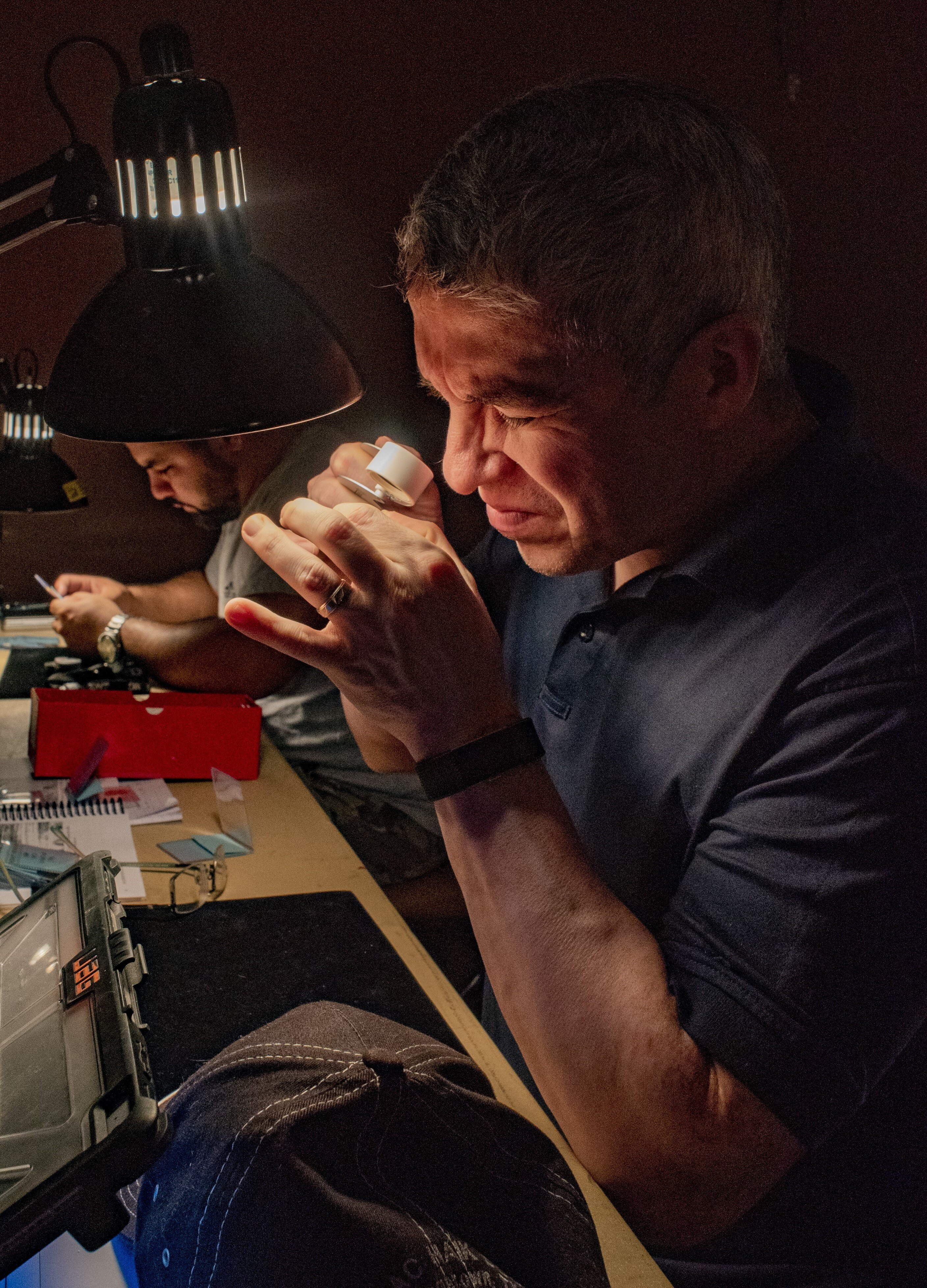 man studying coin cropped